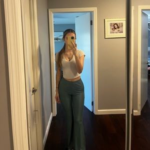 Shiny green flare pants